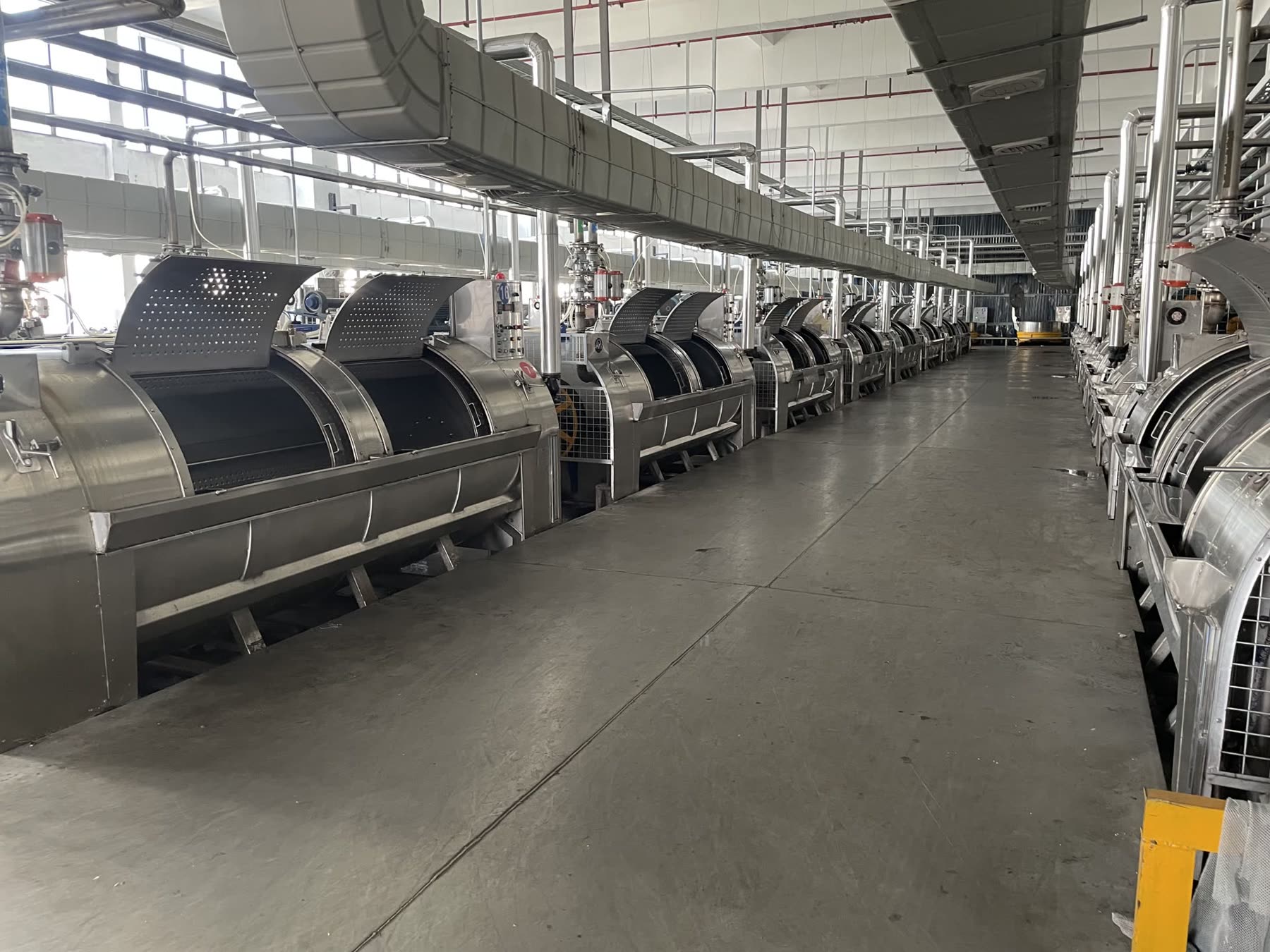 The row of stainless tumblers where the cloth is sand washed and softened